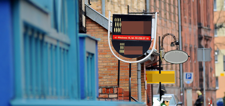 Urzędnicy kontra przedsiębiorcy, czyli starcie o reklamowy porządek na Starym Mieście